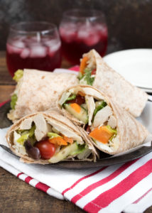 Mediterranean Chicken Wrap- Greek Salad, hummus and seasoned chicken make up this tasty wrap. Great for leftovers or a make-ahead meal! | www.nutritiouseats.com